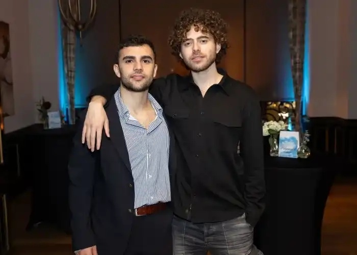 Matthew Modabber (left) with his arm around Shayne Coplan (right).